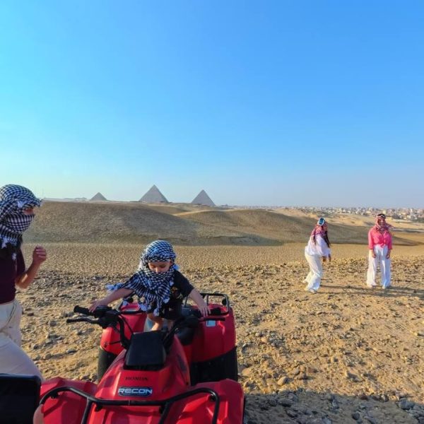 "Quad bike ride through the Egyptian desert with panoramic views of the iconic Pyramids of Giza"